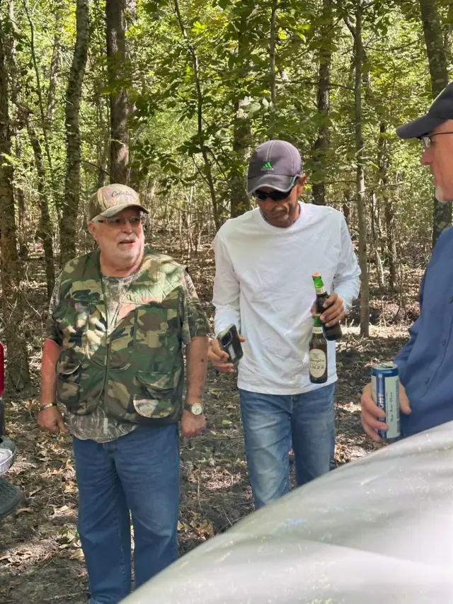 Friends talking in the woods after a ride.