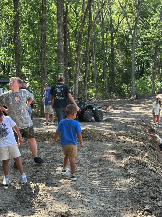 Kids and parents exploring a freshly graded trail.